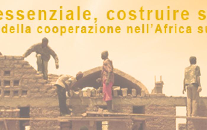 L'immagine riproduce uomini a lavoro per realizzare una costruzione africana